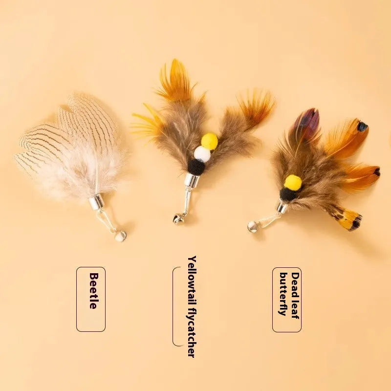 Three steel wire cat toy replacement heads shaped like small flying insects, shown against a plain background.