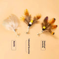 Three steel wire cat toy replacement heads shaped like small flying insects, shown against a plain background.
