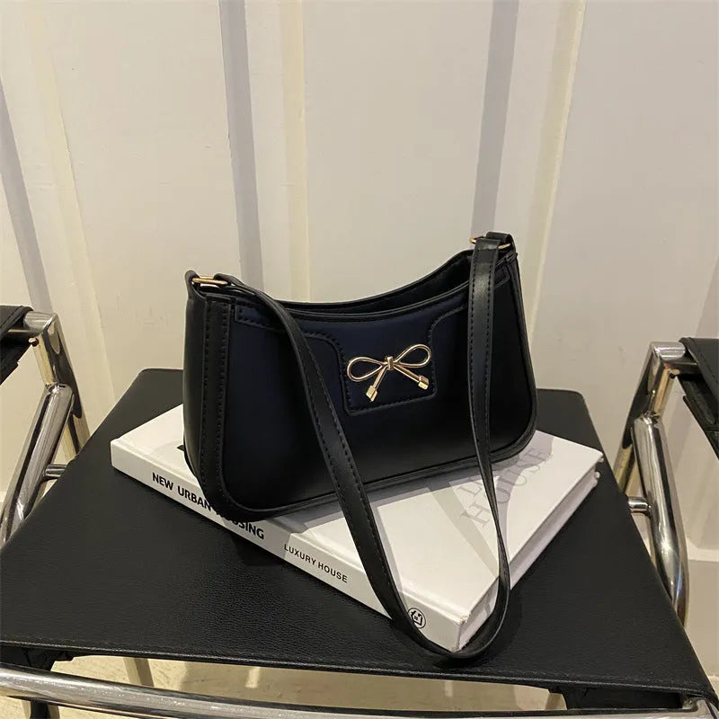 Western style PU leather shoulder bag in horizontal square shape with bow decoration, shown in rose pink colour.