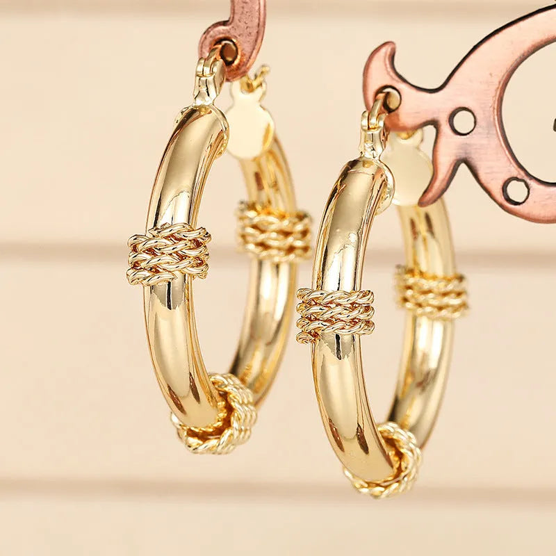 Geometric copper ear clips with ring and line design in golden colour for women