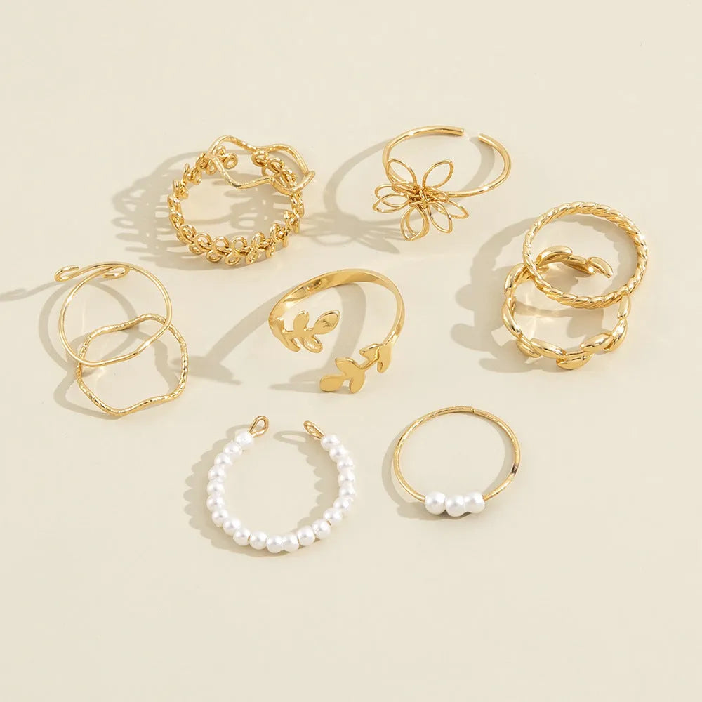 Openwork floral ring set with glossy electroplated finish in gold colour