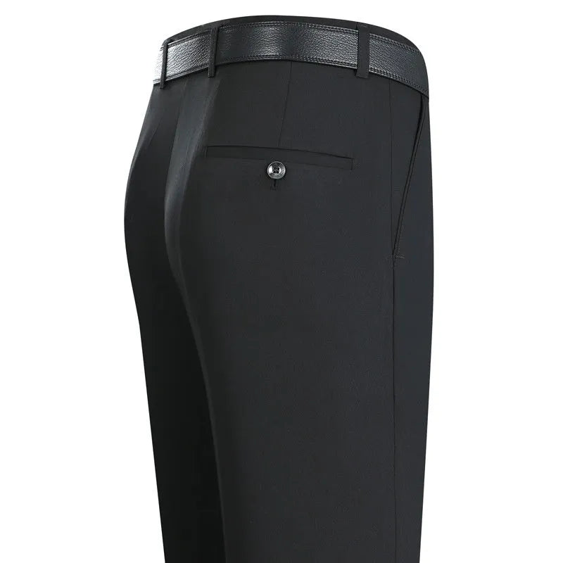 Men's dark blue straight-leg suit trousers with a high waist and non-iron finish on a hanger.