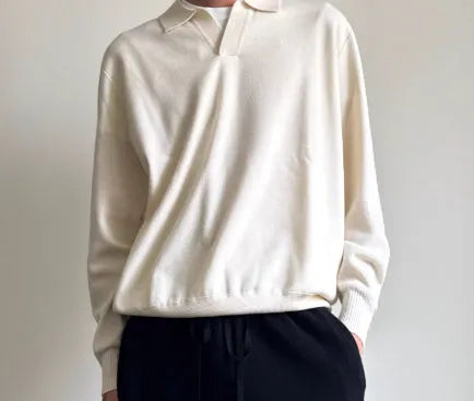 Pure wool polo sweater with lapel collar in milky white, shown in a loose fit.
