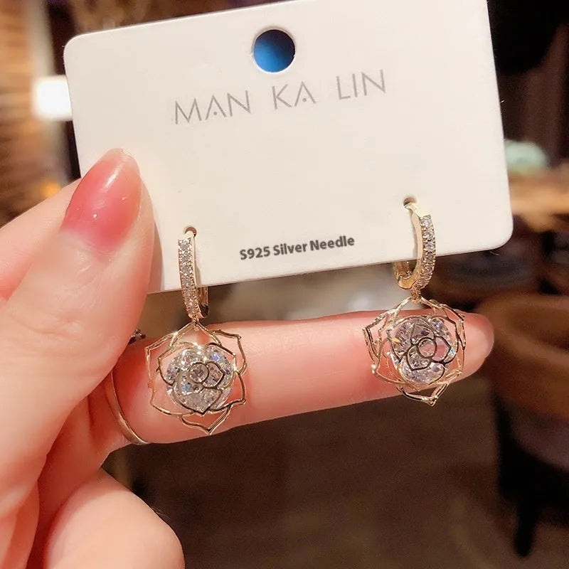 Geometric copper zircon earrings with rose design element in electroplated finish