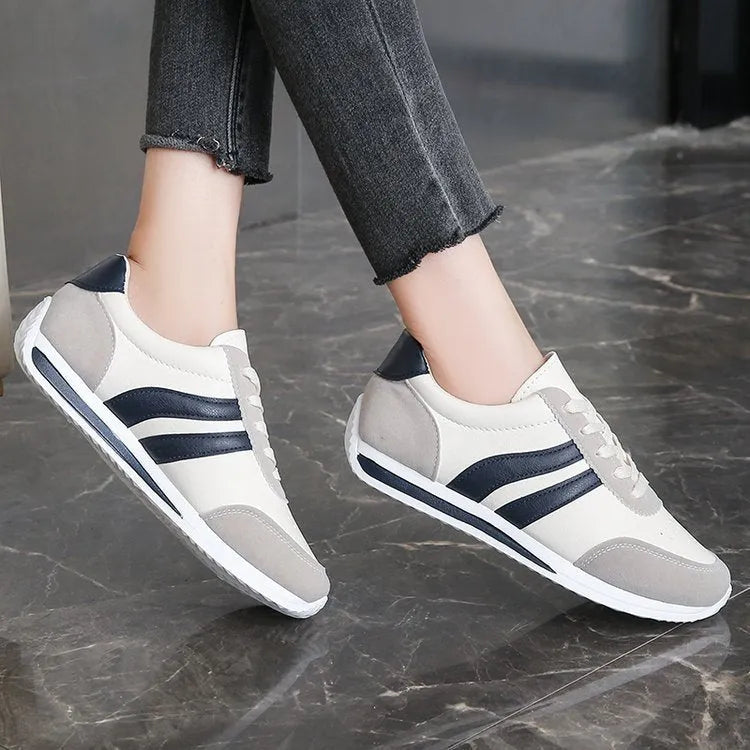 Red and blue lace-up sneakers with soft rubber soles and PU mesh upper