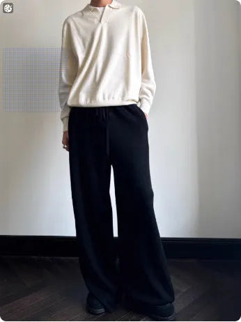 Pure wool polo sweater with lapel collar in milky white, shown in a loose fit.