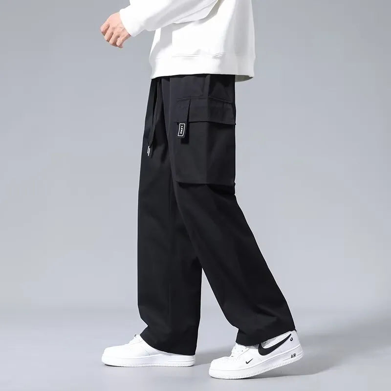 Boys cargo pants with multiple large pockets and drawstring waist in straight leg fit