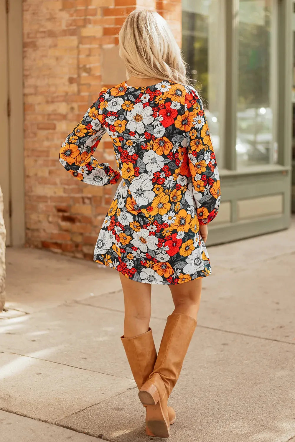 Orange striped floral print mini dress with long sleeves, V-neck, and lace detailing.