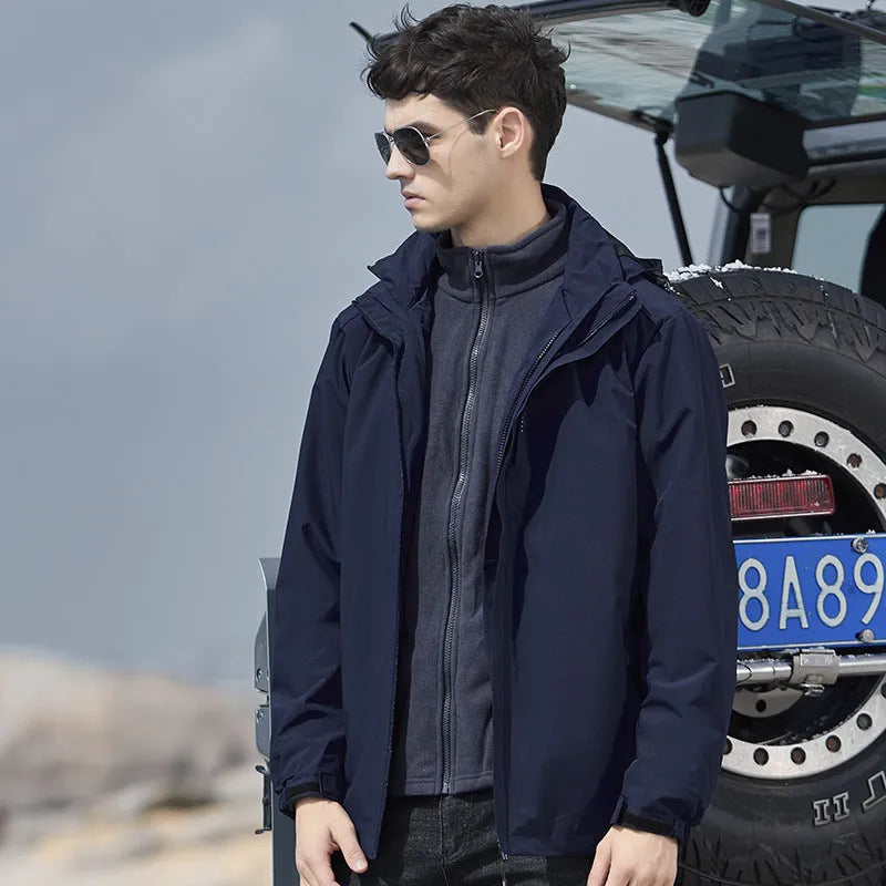 Men's removable two-piece waterproof mountaineering suit in various colours on a hanger.