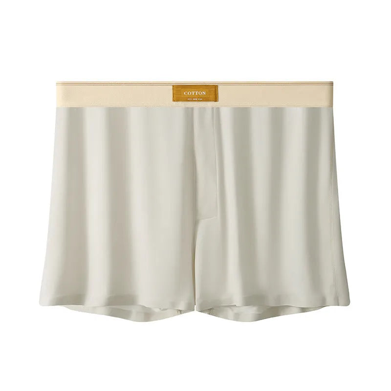 Pack of men's solid colour ice silk boxer shorts showing loose fit and mid-waist design.