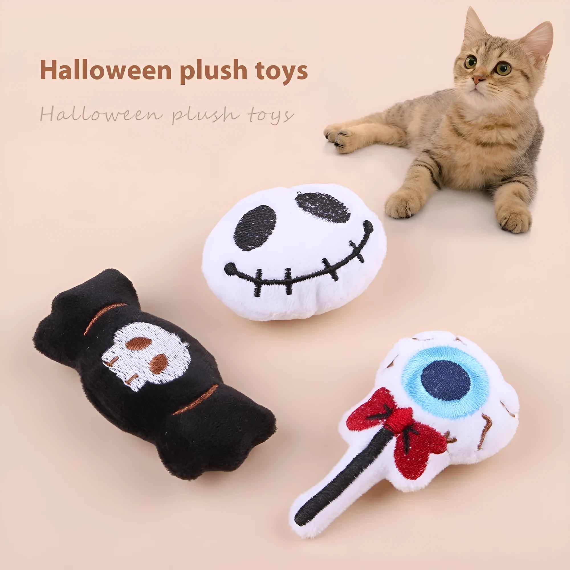 Small colourful plush cat teaser wand with candy, eyes, and skull designs