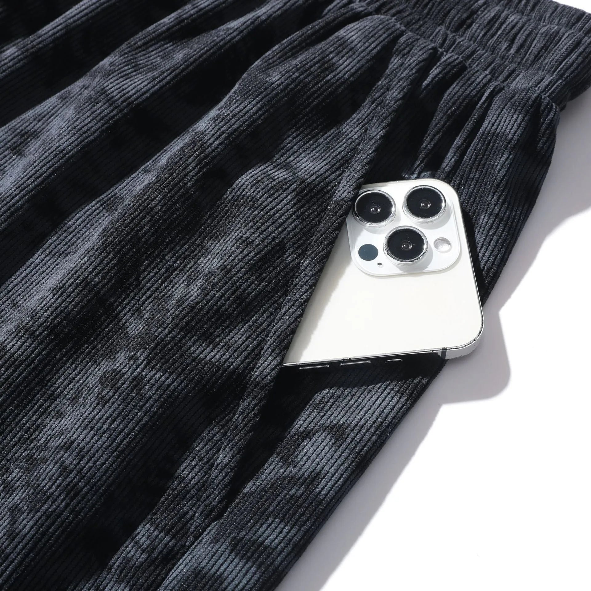 Men's corduroy camouflage shorts with high waist and straight leg cut in black, gray, and white colours