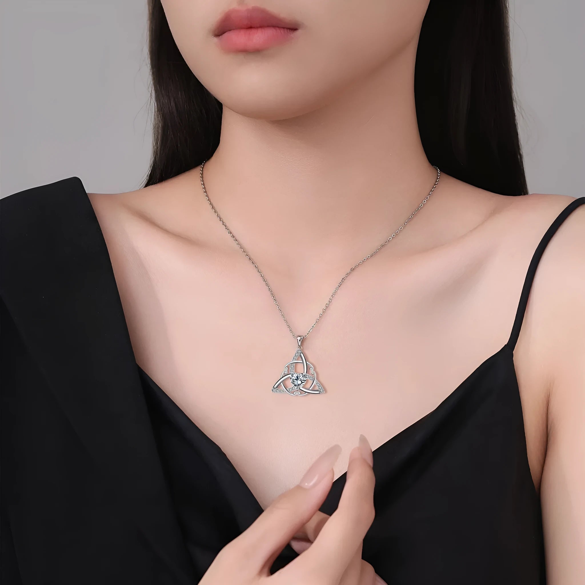 Women's Celtic knot geometric pendant necklace in copper with electroplated blue finish.