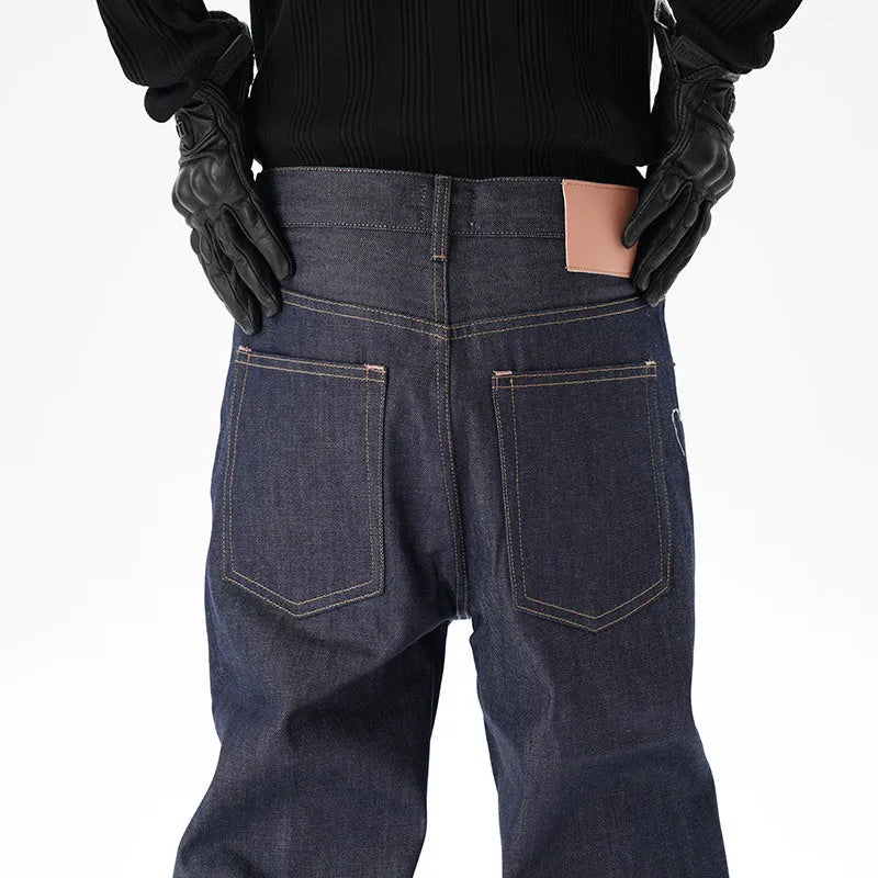 Man's dark blue loose straight-leg casual jeans on a white background.