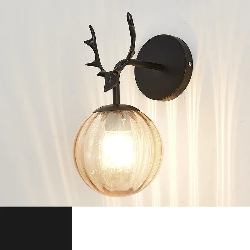 Modern round glass wall lamp with textured shade mounted on a white wall, showing E27 bulb holder.