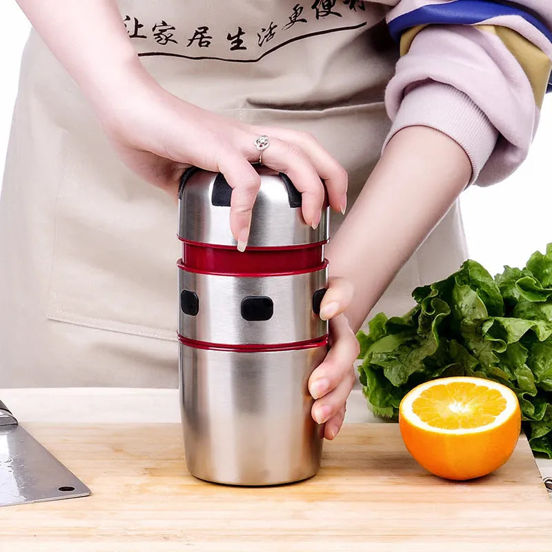 Manual stainless steel citrus juicer with 304 filter and press handle on a kitchen counter