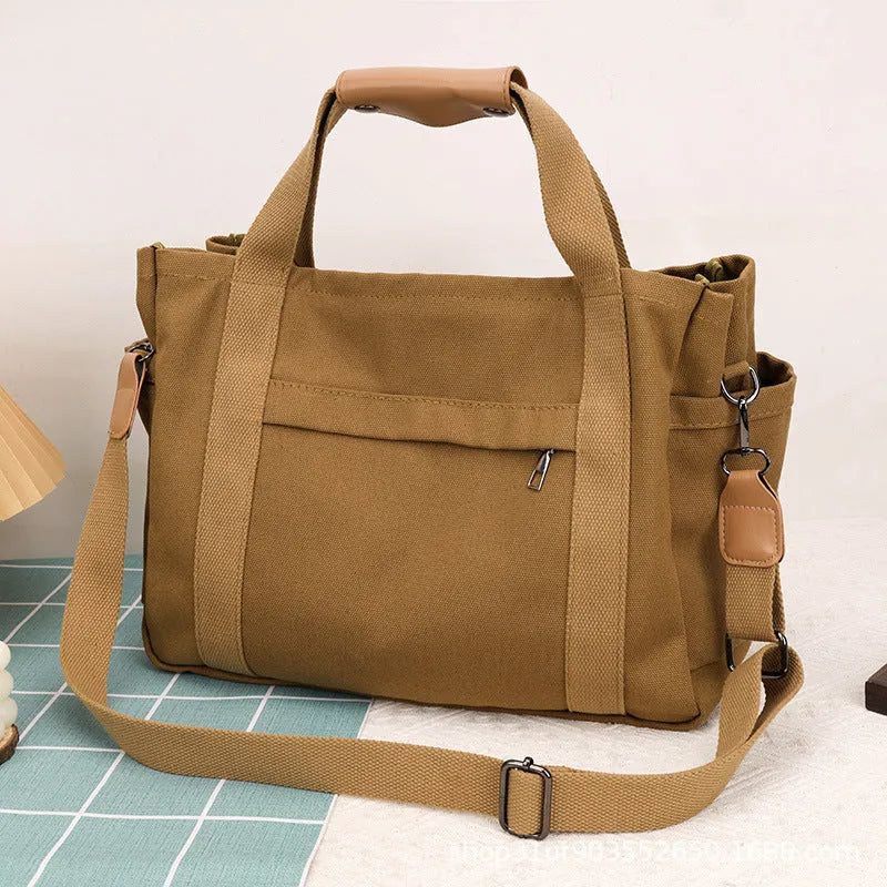 Large canvas tote bag with internal organisation pockets in neutral colour