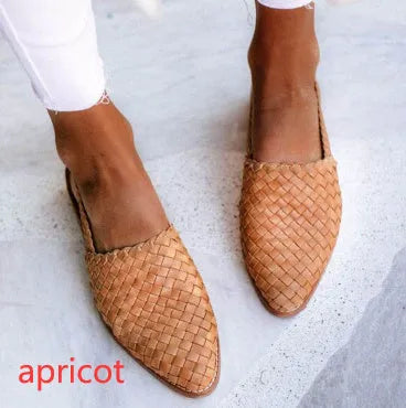 Pointed-toe flat casual sandals with a buckle strap on a microfiber upper and rubber sole.
