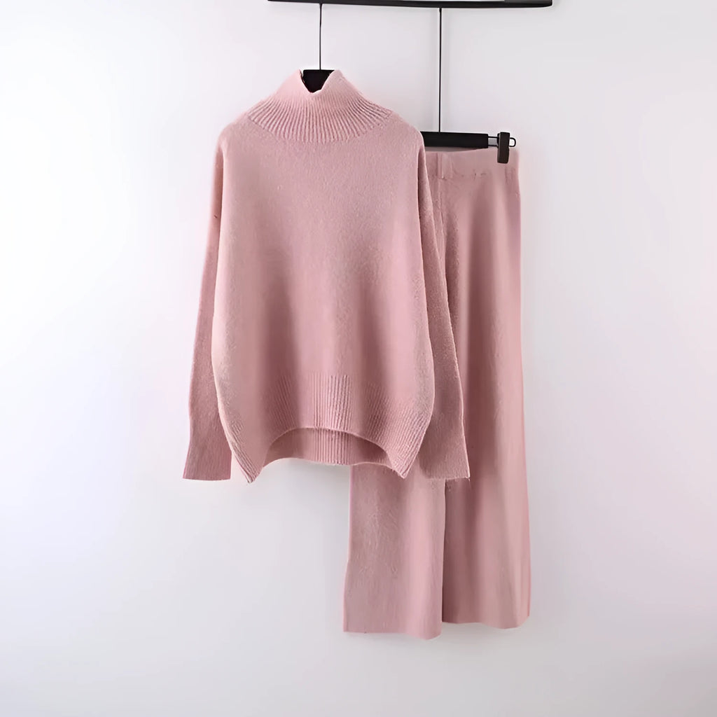 Women's beige acrylic knit sweater and wide-leg trousers two-piece set laid flat.