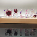 White dried flower alphabet night light in crystal epoxy with real flowers, available in 3 to 8 letters.