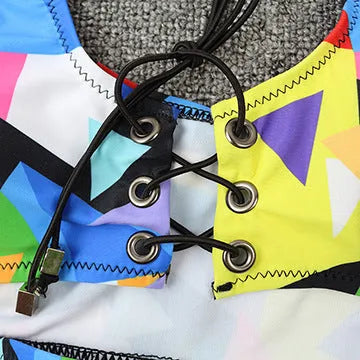 Women's multicolour checkered bikini set with cross-strap top and fishnet high-waist shorts