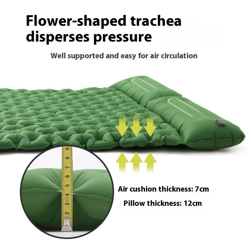 Dark blue double air mattress with built-in pump inflated on a floor, showing integrated pillow.