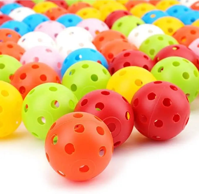 Multi-colour 42mm golf practice balls in a net pocket, showing red, orange, blue, green, white, and yellow balls.