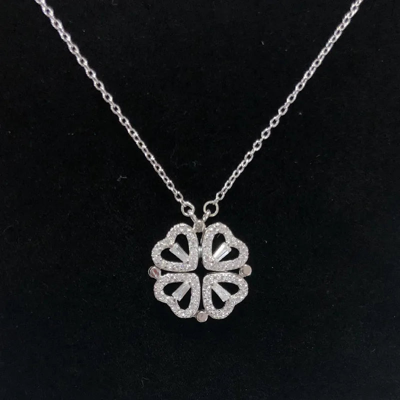 Heart shape four leaf clover pendant necklace in cupronickel 18K gold finish on white background