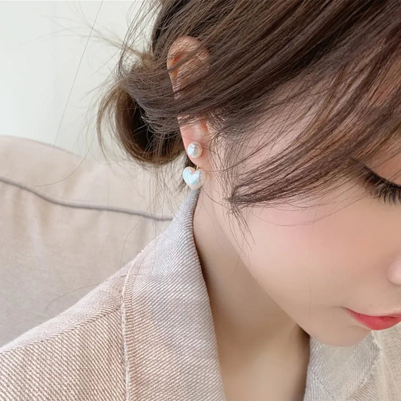 Heart-shaped alloy stud earrings with electroplated finish and inlaid artificial stones.