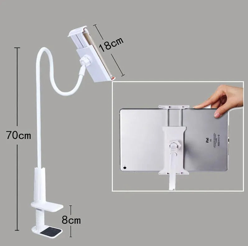 Black aluminium alloy bedside phone handset with a long arm and wide clamp, holding a mobile phone above a bed.