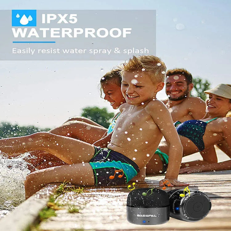 Black portable mini waterproof Bluetooth speaker with buttons on a plastic shell.
