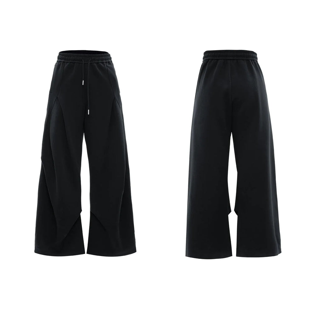 Men's dark grey V-neck cotton sports suit with padded shoulder jacket and matching shorts.