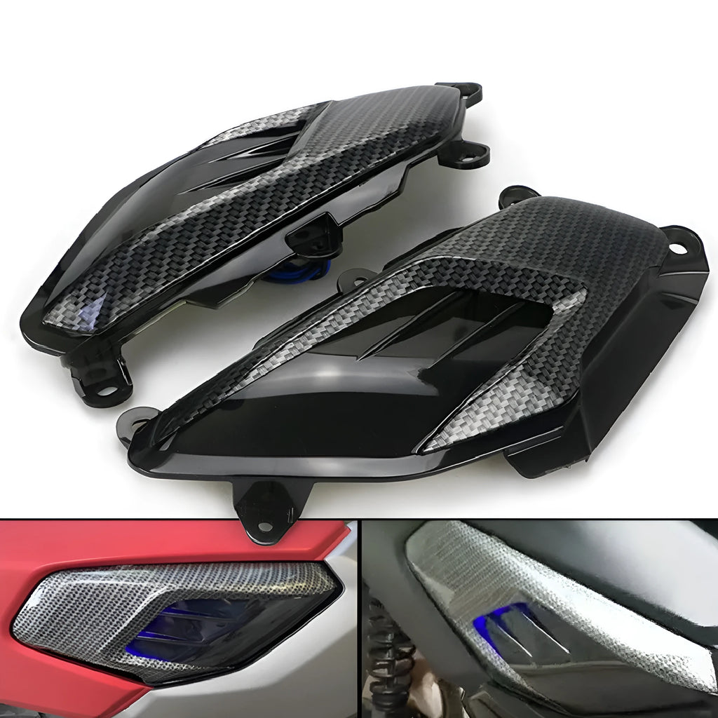 Pair of black LED side lamps for Yamaha NMAX scooter with carbon fibre decoration and clear lens.