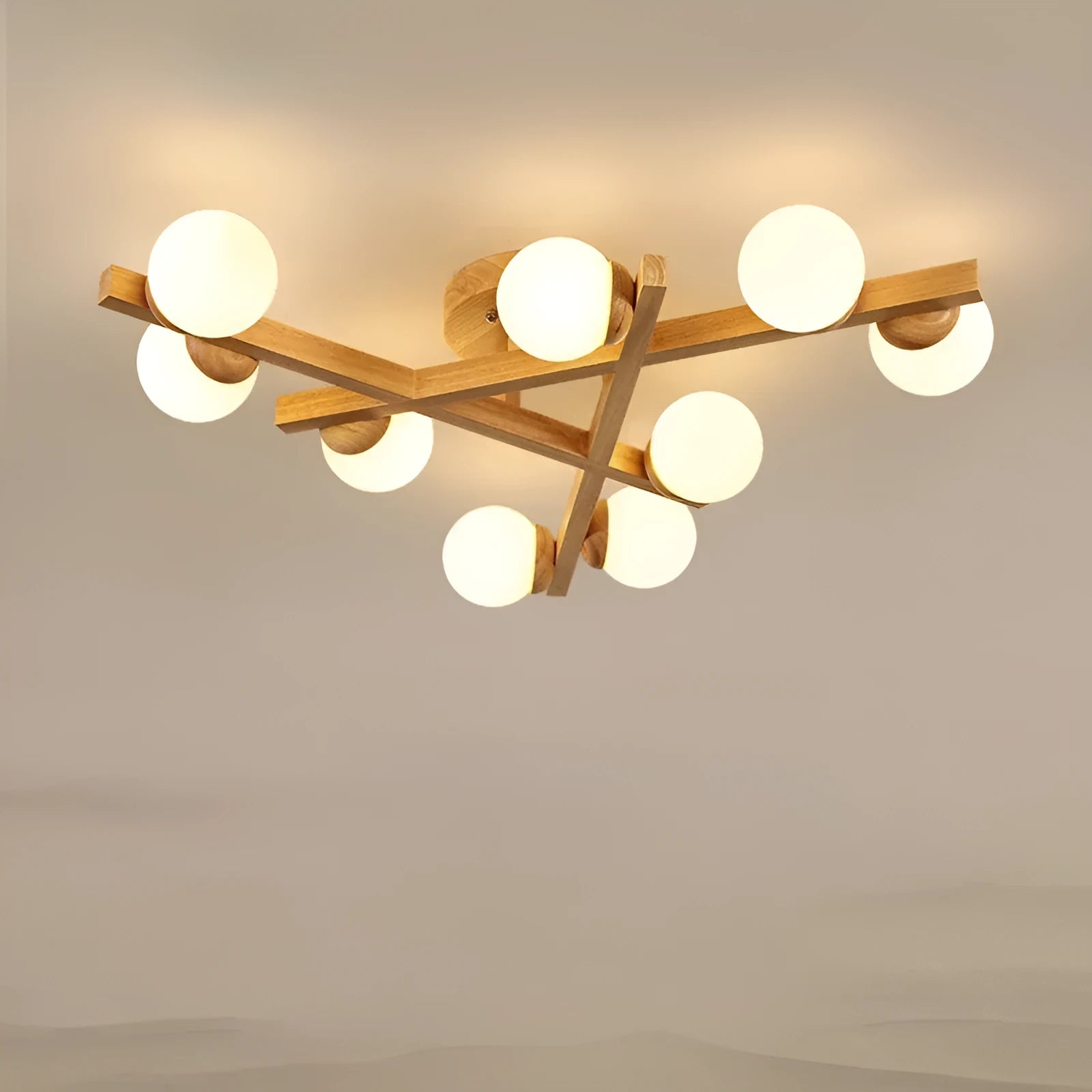 Scandinavian wooden-style ceiling light with three adjustable black lamp heads on angled arms
