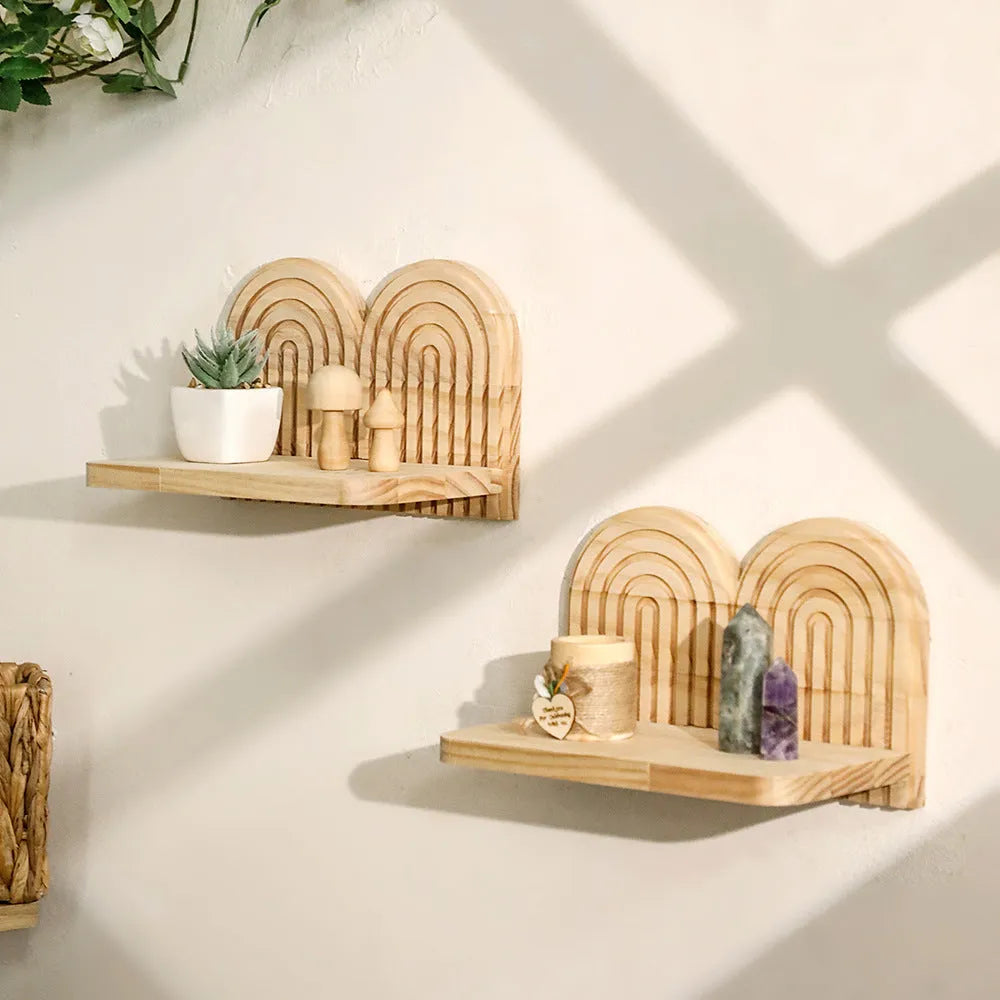 Solid wood multi-layer wall shelf holding several small potted plants.