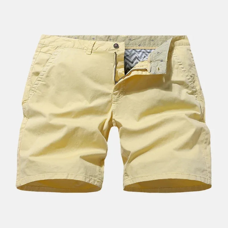 Men's loose-fit straight-leg denim shorts in a printed blue colour, shown laid flat.