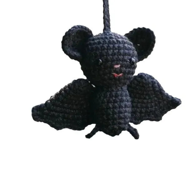 Plush hand-woven car hanging ornament in a cartoon design, made from soft polyester fabric.