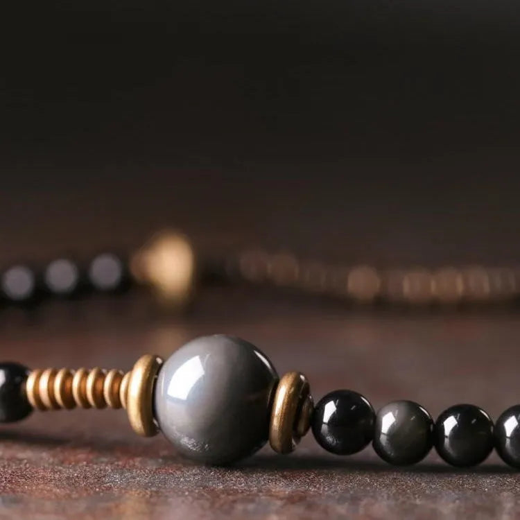 Black retro colourful geometric beaded bracelet with a multi-layered design.