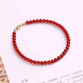 Ultra-thin red agate bracelet for women on a white background.