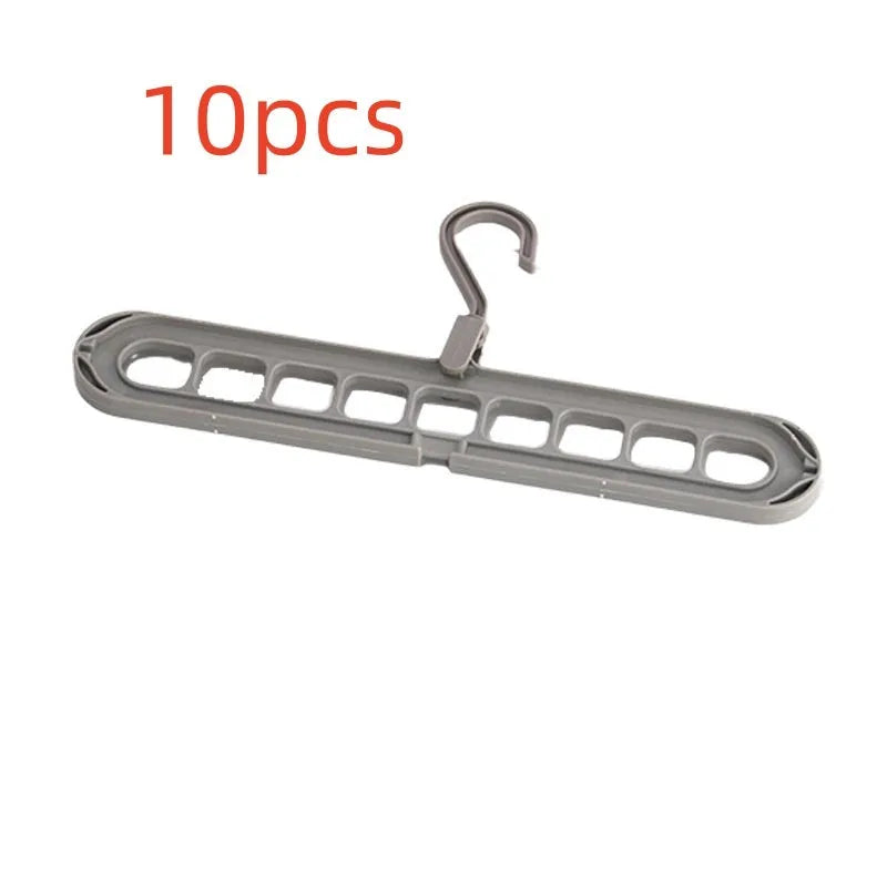 Multifunctional plastic hanger with nine holes for folding trousers, shown in beige