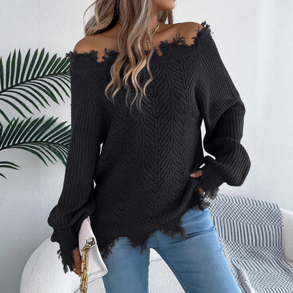 Women's white cut-off-the-shoulder long sleeve pullover sweater with hollow-out detail on front.