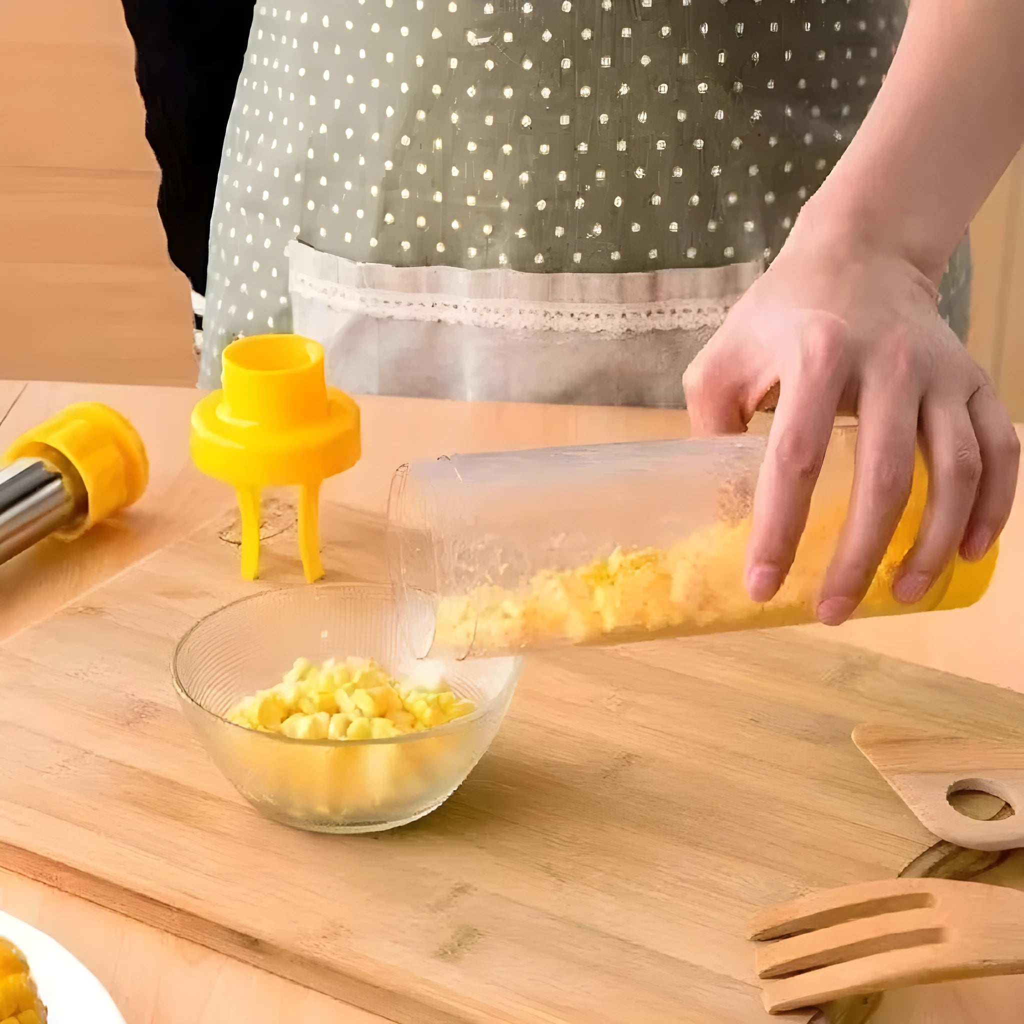 Yellow cylindrical corn stripper kitchen tool made from ABS plastic and stainless steel