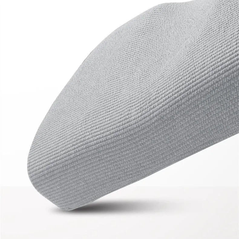 Grey memory foam massage pillow with knitted cotton cover and adjustable loft for neck support