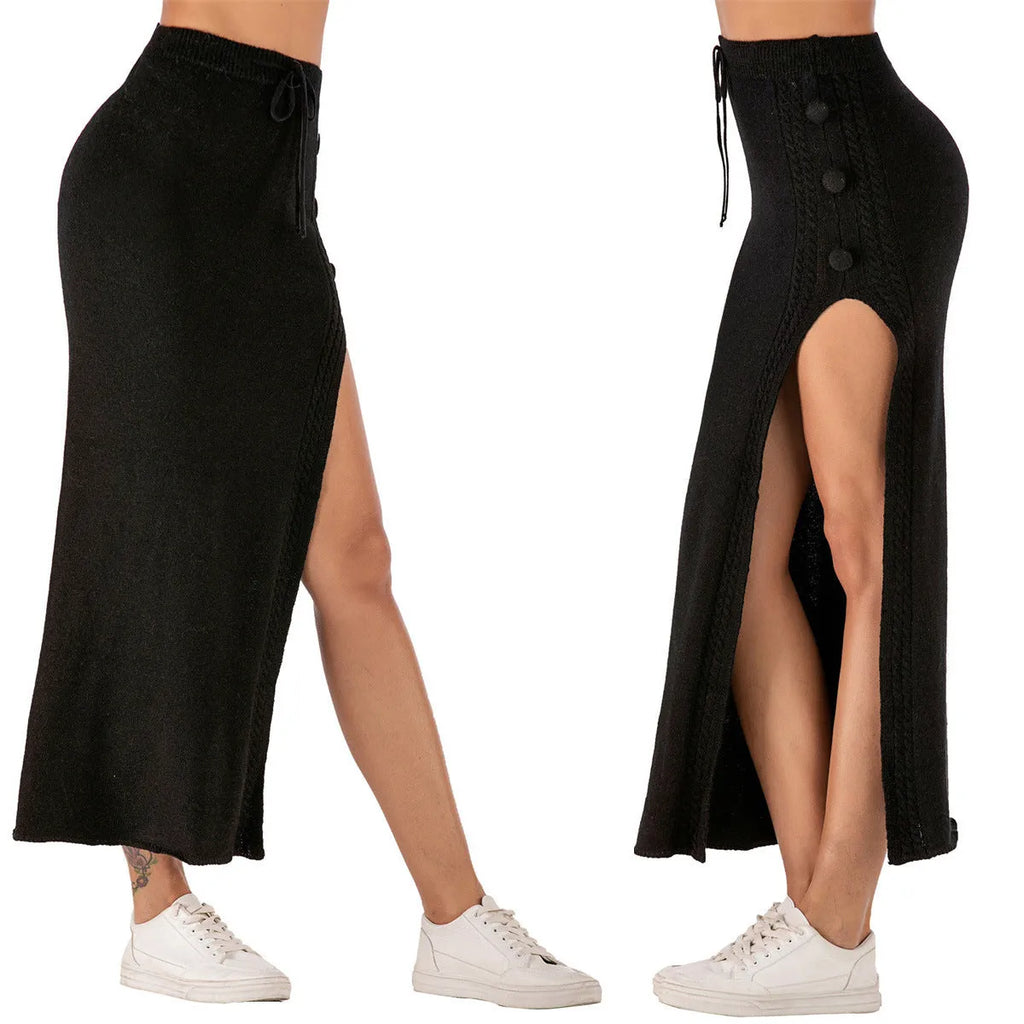 Black slim-fit acrylic midi skirt with a side split and strap detailing on a model.