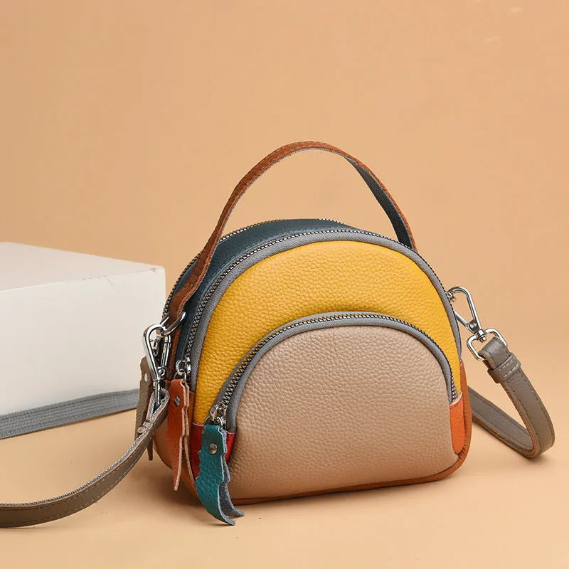 Hand-held crossbody first layer cowhide leather single-shoulder bag in soft round shape with sewing line detail