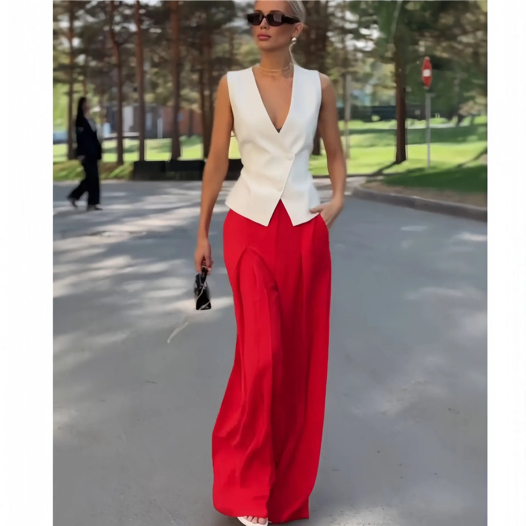Women's beige polyester two-piece set with sleeveless deep V-neck top and high-waist wide-leg trousers.