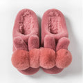 Women's high-top bunny slippers in creamy white with rabbit fur upper and floral detail.
