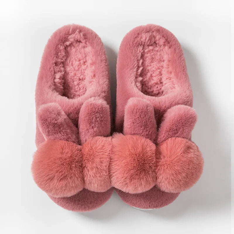 Women's high-top bunny slippers in creamy white with rabbit fur upper and floral detail.