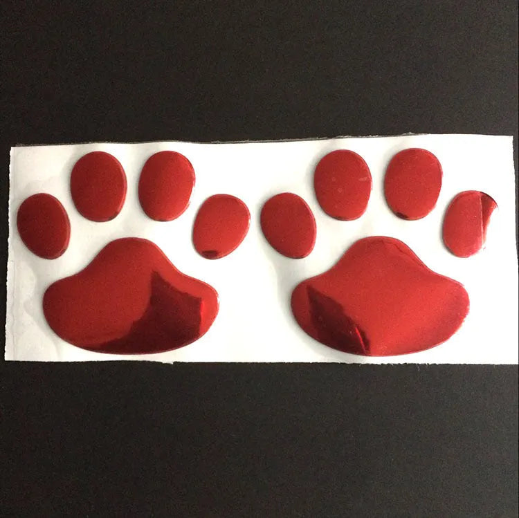 PVC car sticker with hand-shaped brush dog footprints design on a car bumper.