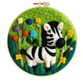 Round fabric embroidery kit with linen square, wool felt, and embroidery frame for handmade decorations.